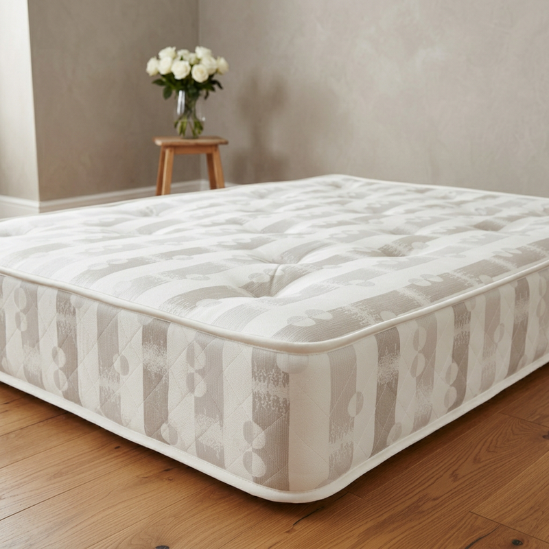 Damask mattress close-up with the matching warm-grey background